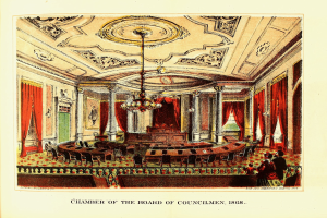 Eine Zeichnung des Rates der Stadtverordneten von 1868, die einen Raum mit Stüllen, Tischen, Vorhängen, Säulen, einem Kronleuchter und einer Decke zeigt, sowie einige Menschen und ein Schriftstück mit Text.