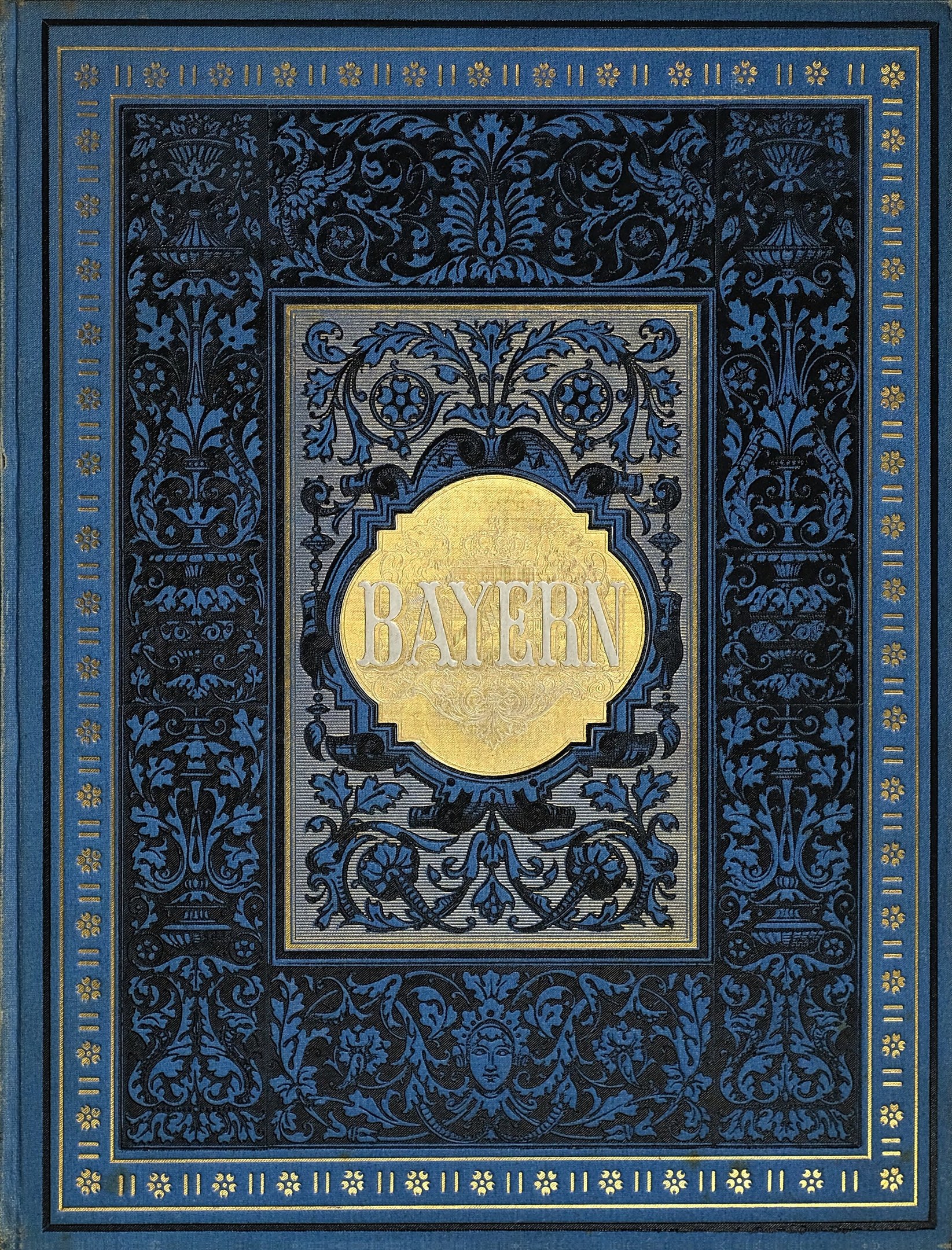 Ein blau-goldenes Buch mit der Aufschrift 'Bayern' auf seinem kunstvoll gestalteten Einband.