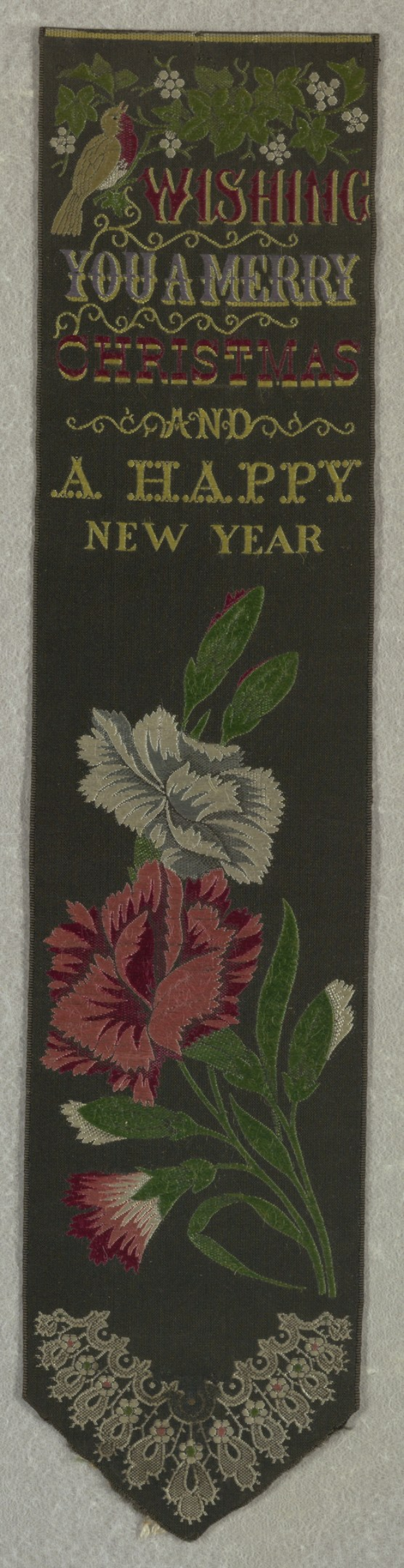 Schwarze Flagge mit rot-weißer Blumenzeichnung und Stickerei 'Frohe Weihnachten und ein gutes neues Jahr', umgeben von bunten Blumen und Bl├Ąttern.