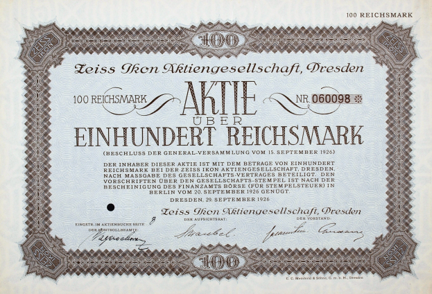 Altes deutsches Aktienzertifikat für 100 Reichsmark mit schwarzem Rand und deutschem Text.